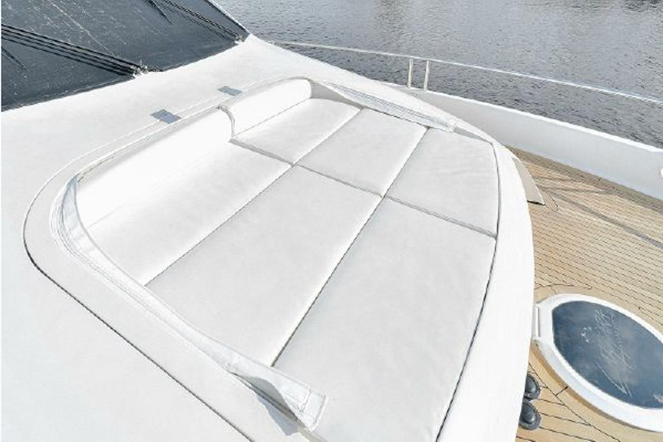 a white laptop on a table aboard 2007 LAZZARA 84 MOTOR Yacht for Sale