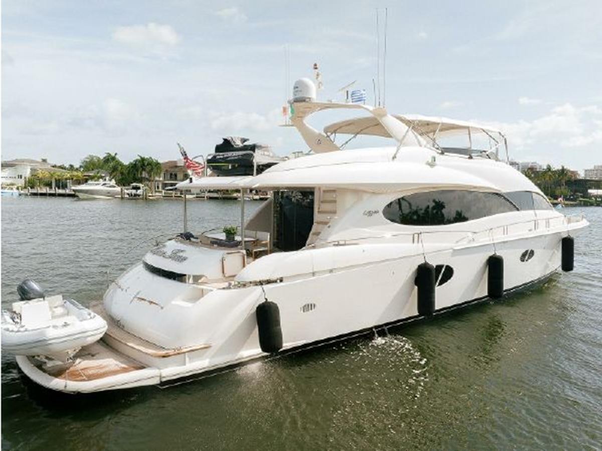 a white boat on a body of water aboard 2007 LAZZARA 84 MOTOR Yacht for Sale