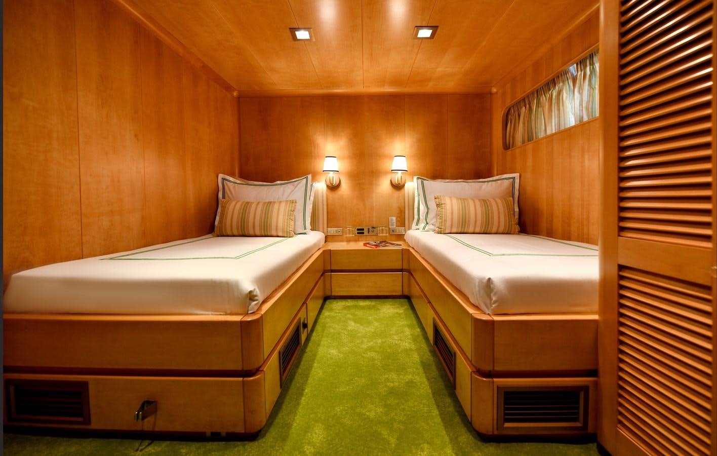 a room with two beds aboard SOMETHING COOL Yacht for Sale
