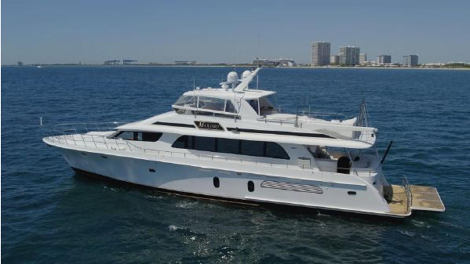 a white yacht in the water aboard 2006 CHEOY LEE MOTOR Yacht for Sale