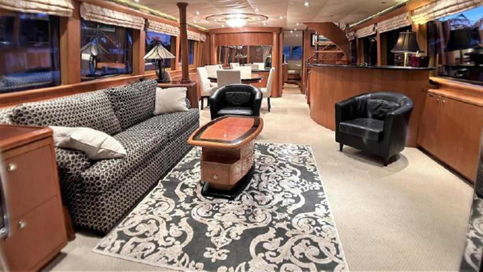 a room with a couch and a chair aboard 2006 CHEOY LEE MOTOR Yacht for Sale