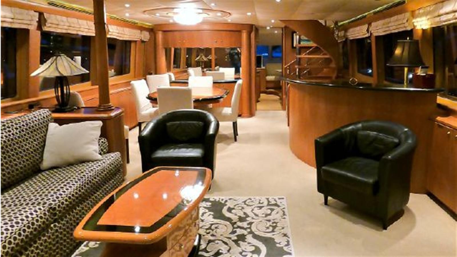 a living room with a couch and a table aboard 2006 CHEOY LEE MOTOR Yacht for Sale
