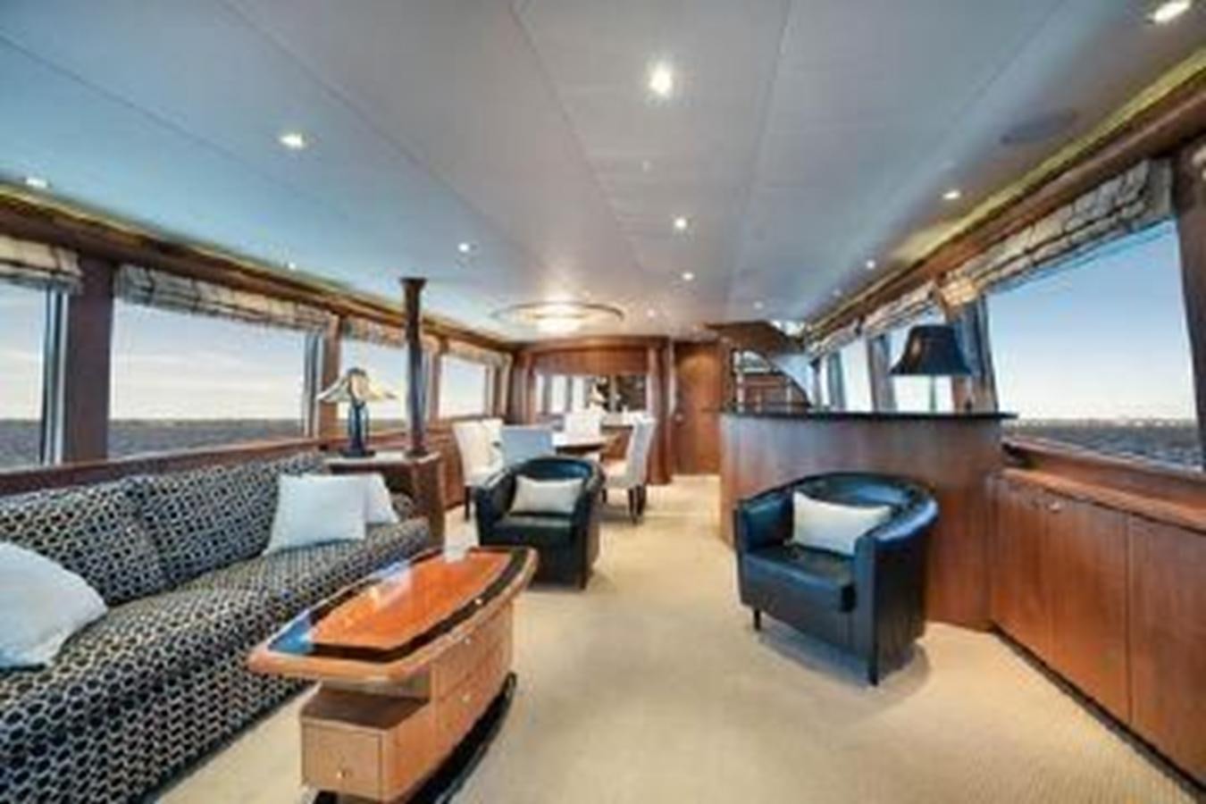 a living room with a couch and a table aboard 2006 CHEOY LEE MOTOR Yacht for Sale