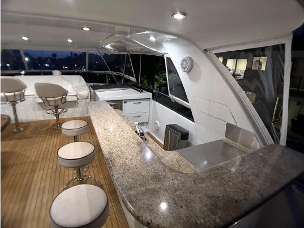 a kitchen with a large marble counter aboard 2006 CHEOY LEE MOTOR Yacht for Sale