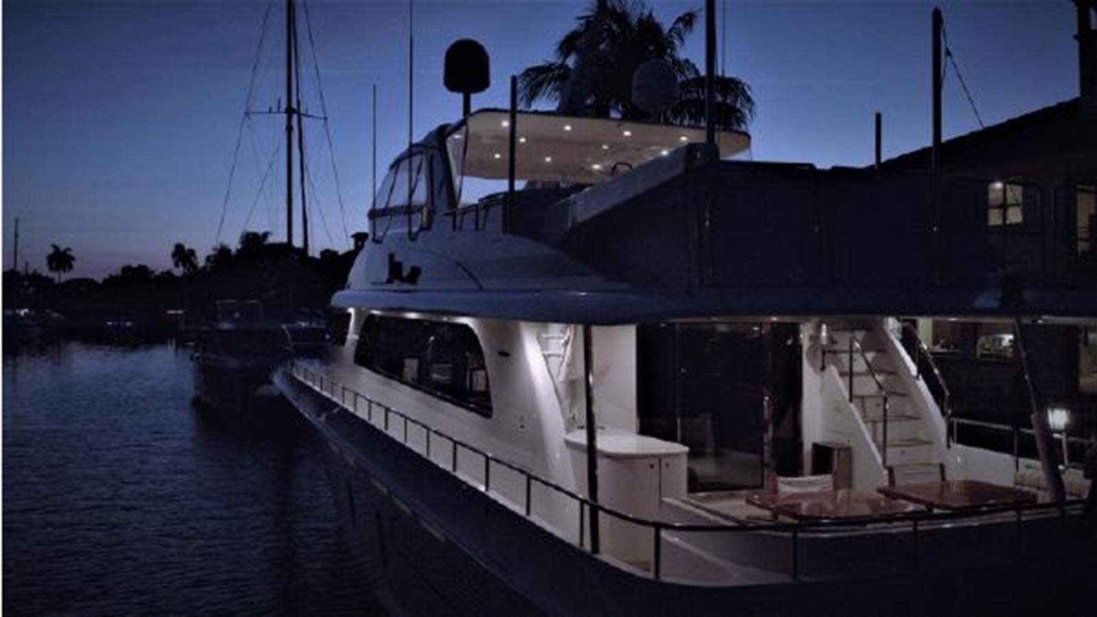 a large ship docked aboard 2006 CHEOY LEE MOTOR Yacht for Sale