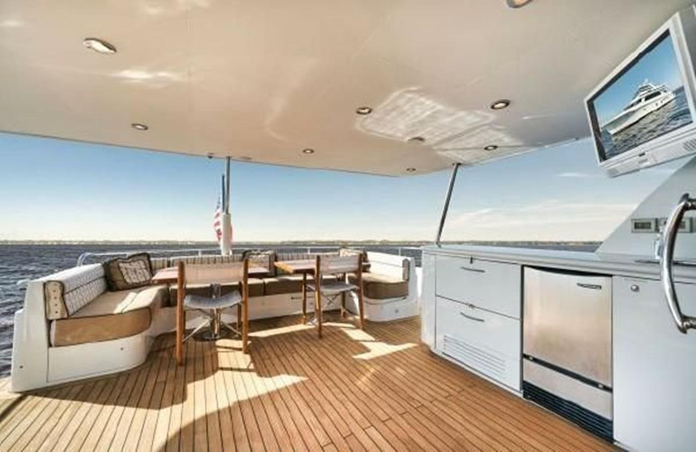 a boat with a table and chairs aboard 2006 CHEOY LEE MOTOR Yacht for Sale