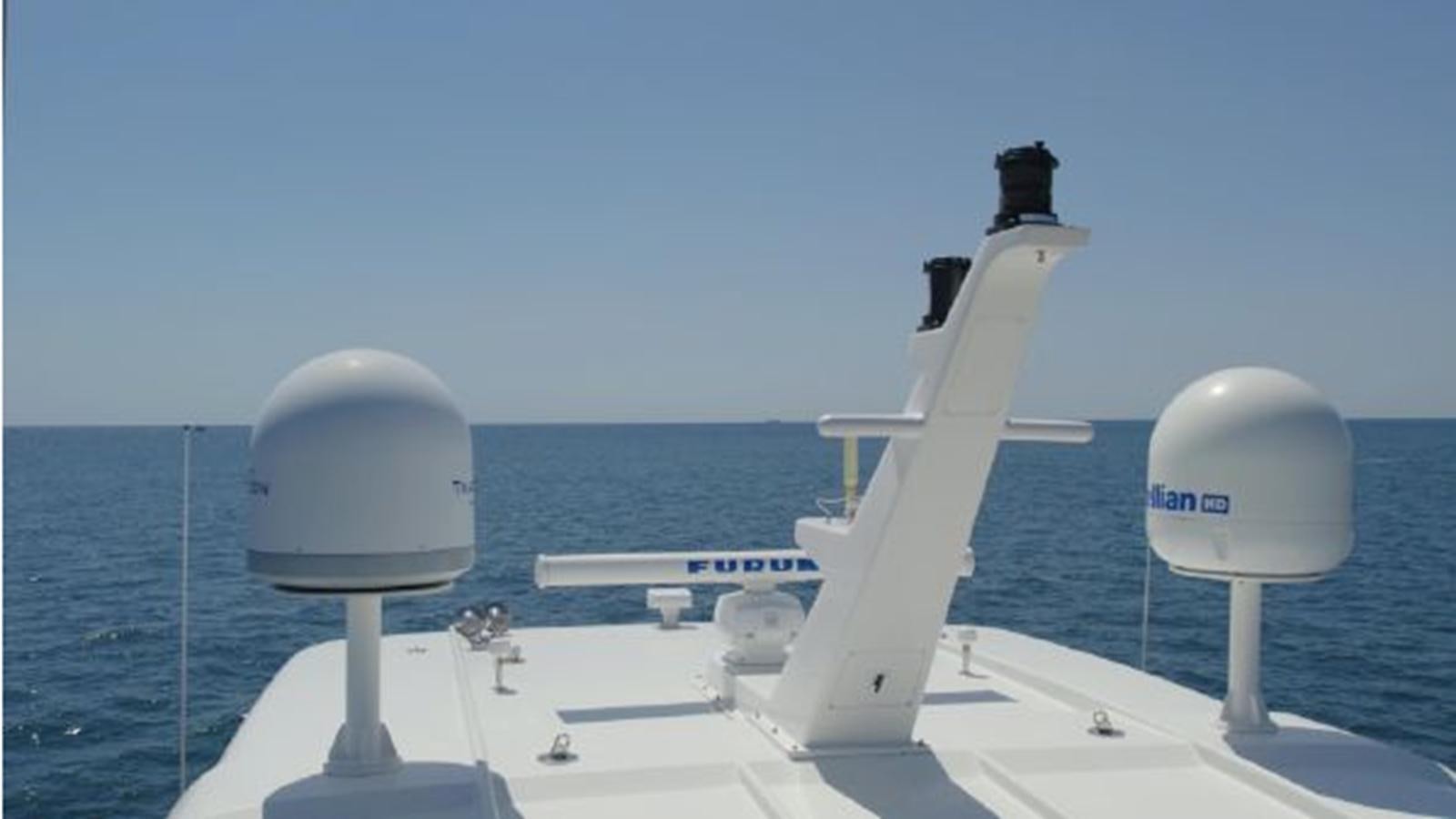 a white boat with a white tower and a white tower on the water aboard 2006 CHEOY LEE MOTOR Yacht for Sale