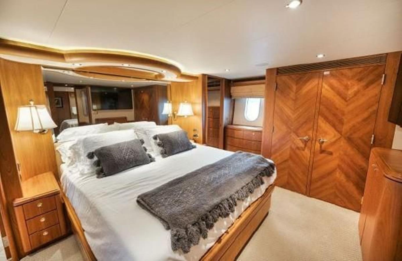 a large bed in a room aboard 2006 CHEOY LEE MOTOR Yacht for Sale