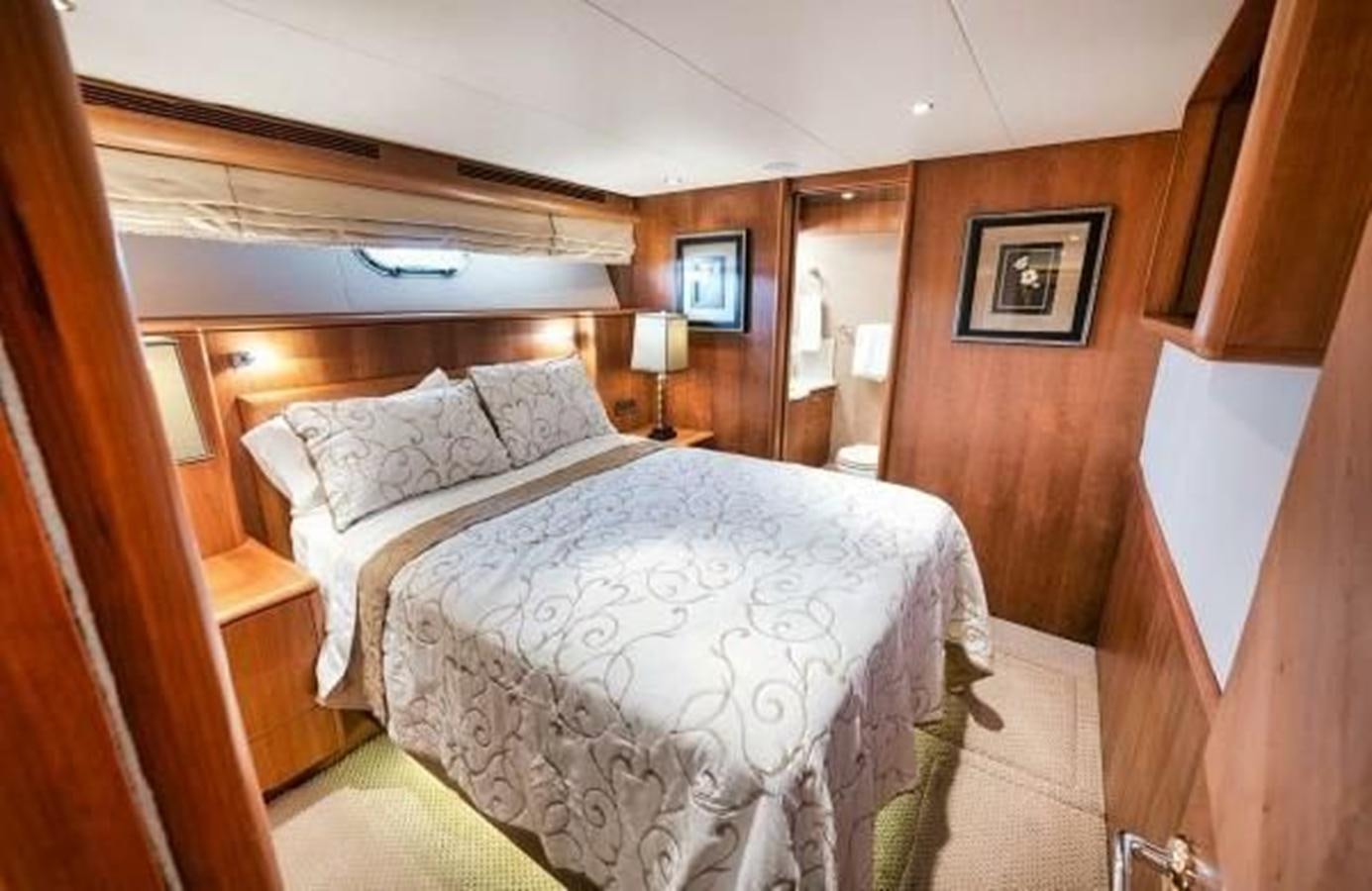 a bed in a room aboard 2006 CHEOY LEE MOTOR Yacht for Sale