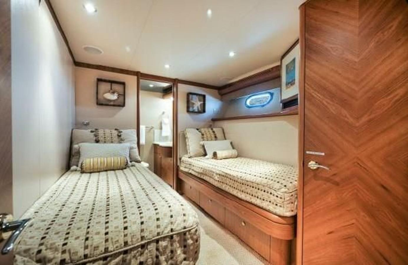 a couple of beds in a room aboard 2006 CHEOY LEE MOTOR Yacht for Sale