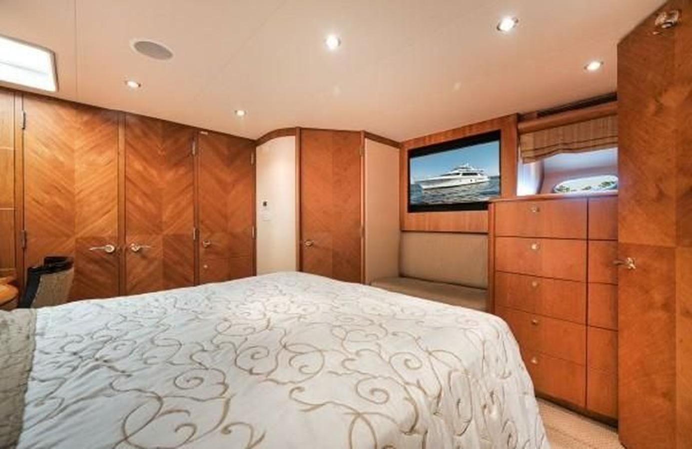 a bed in a room aboard 2006 CHEOY LEE MOTOR Yacht for Sale