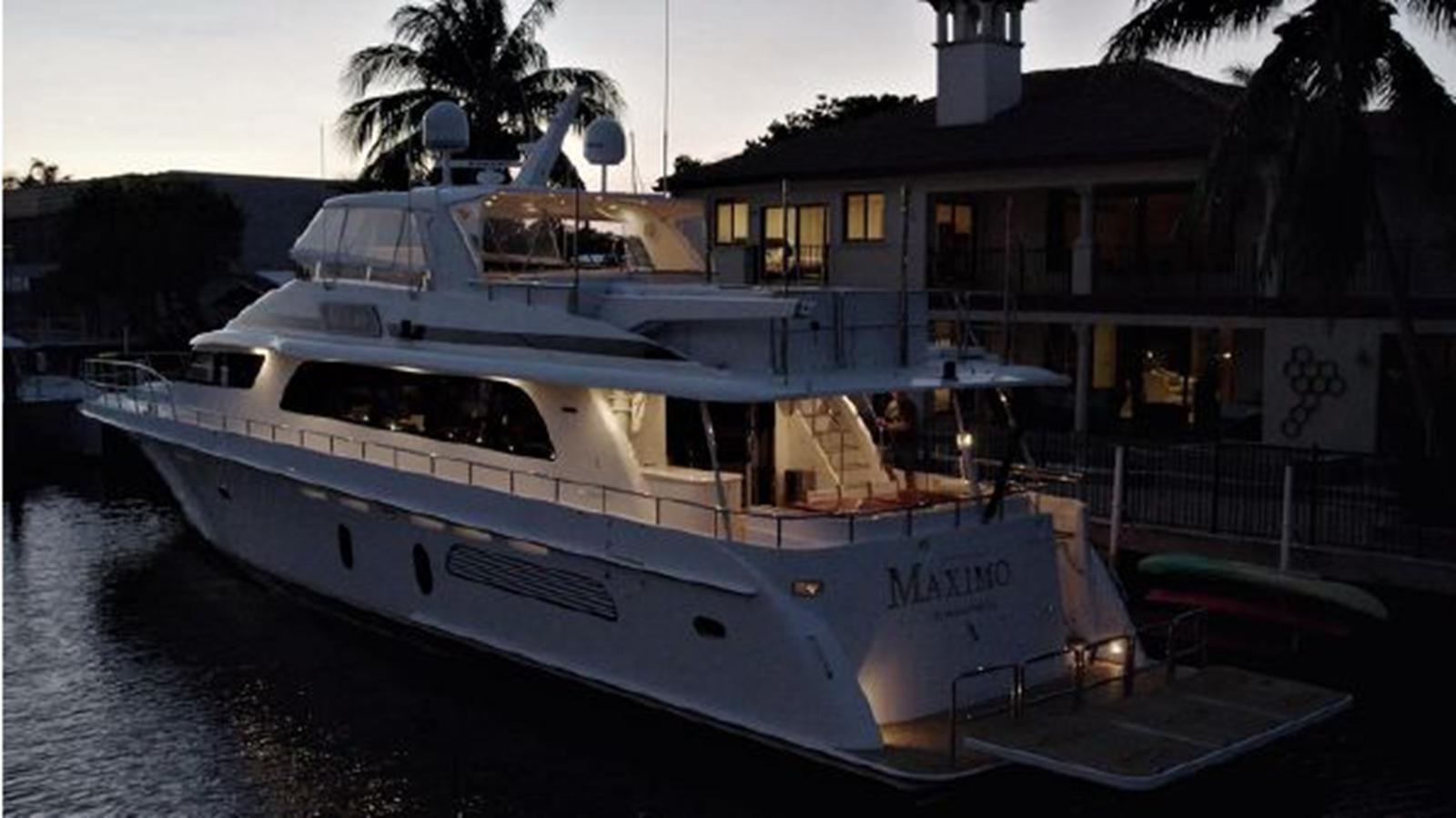 a boat docked at a pier aboard 2006 CHEOY LEE MOTOR Yacht for Sale