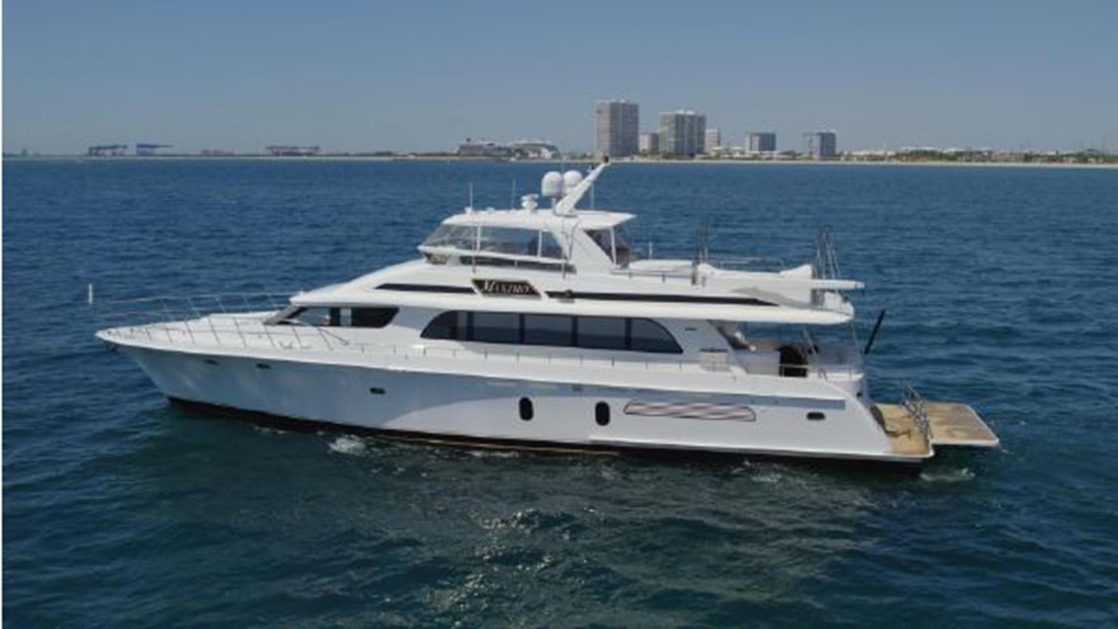 a white yacht in the water aboard 2006 CHEOY LEE MOTOR Yacht for Sale