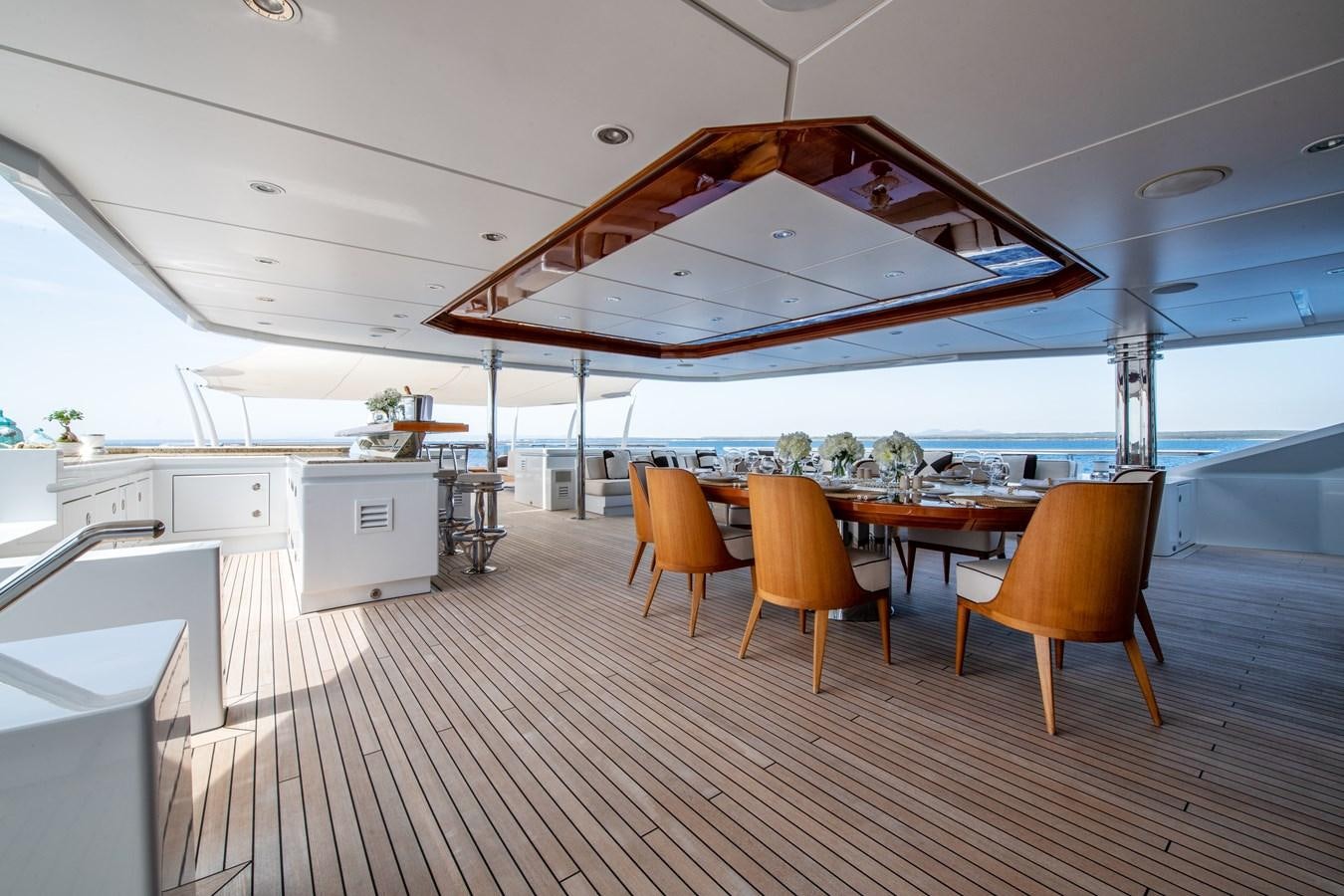 a large room with tables and chairs aboard AALTO Yacht for Sale
