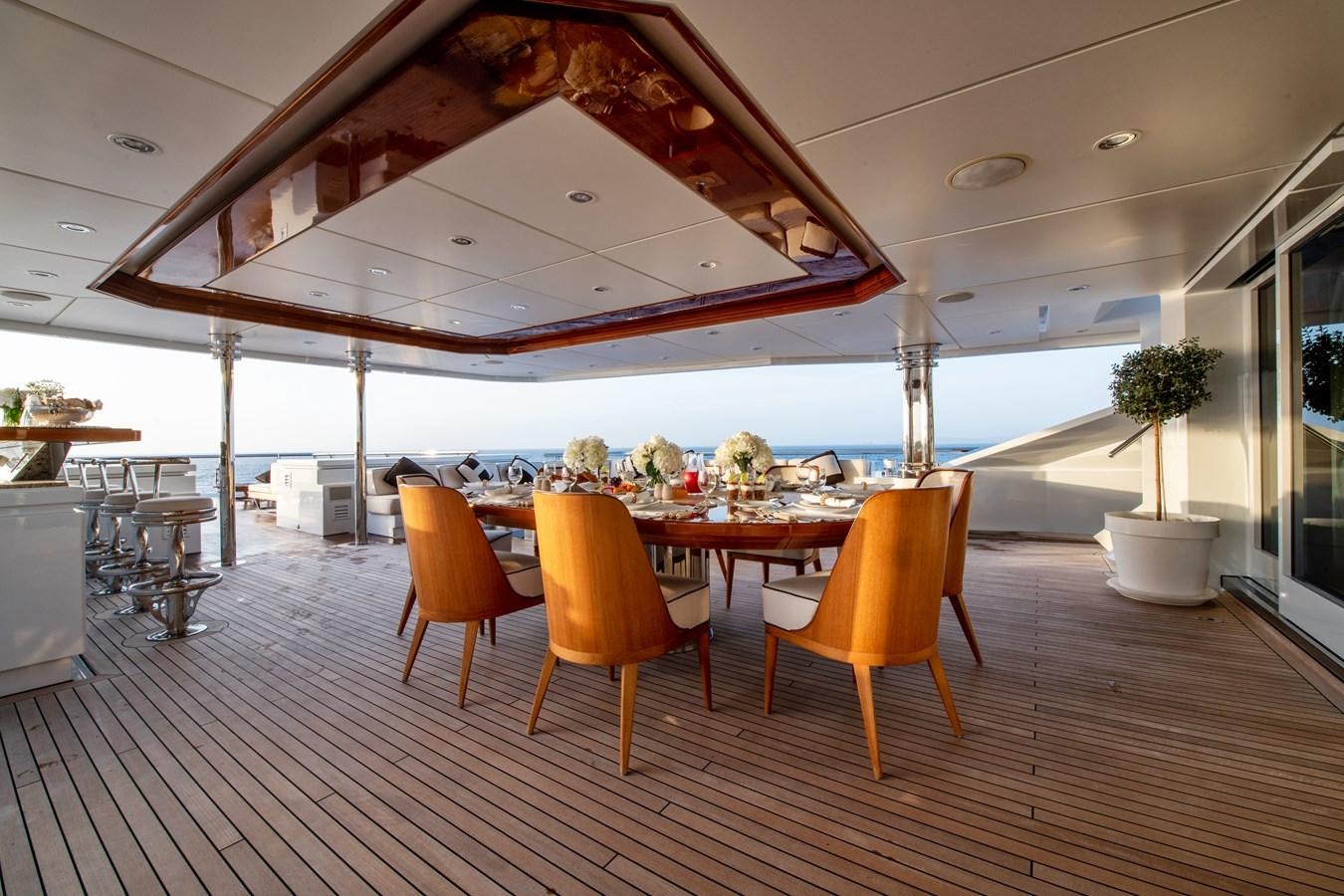 a room with a table and chairs aboard AALTO Yacht for Sale
