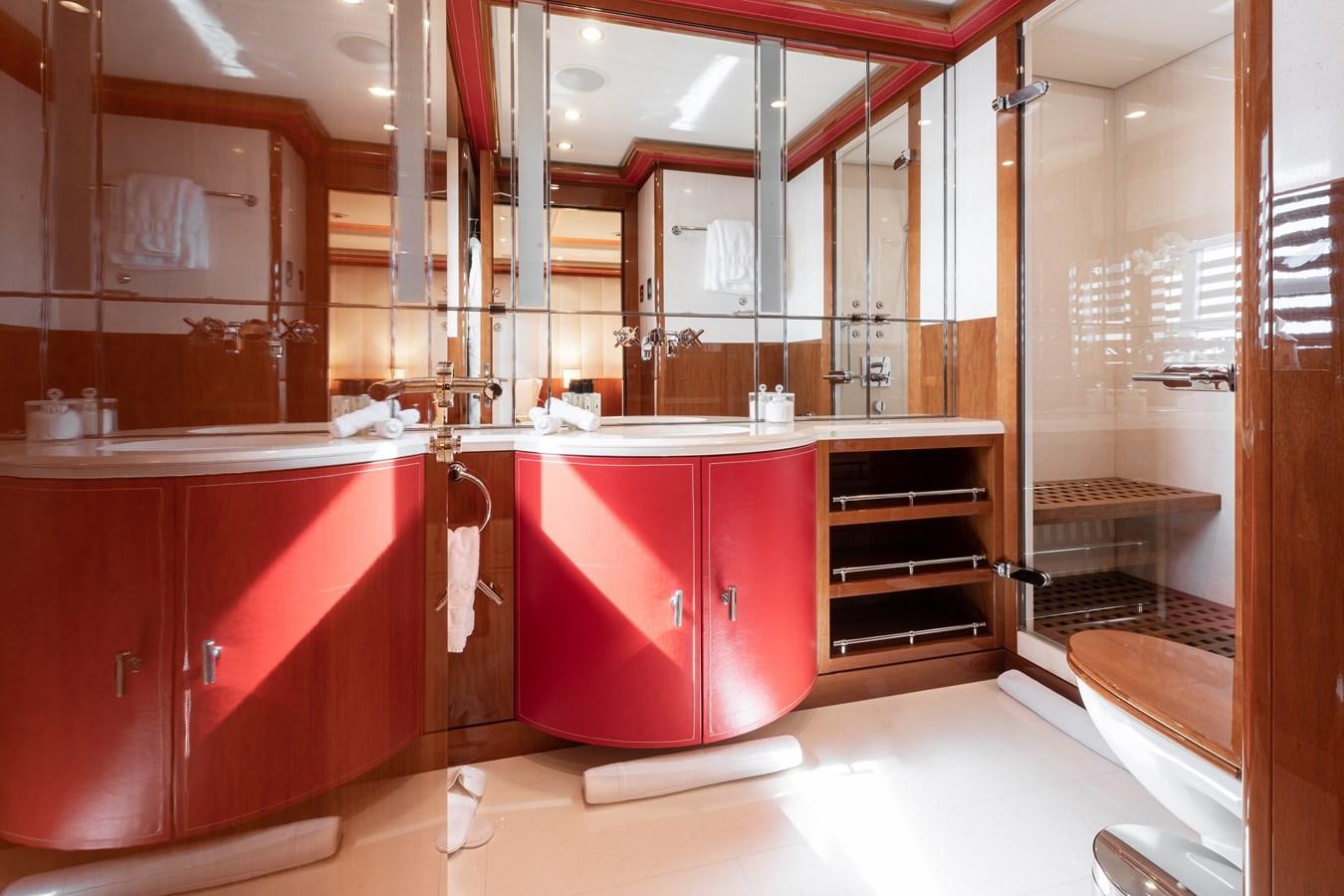 a kitchen with red cabinets aboard AALTO Yacht for Sale