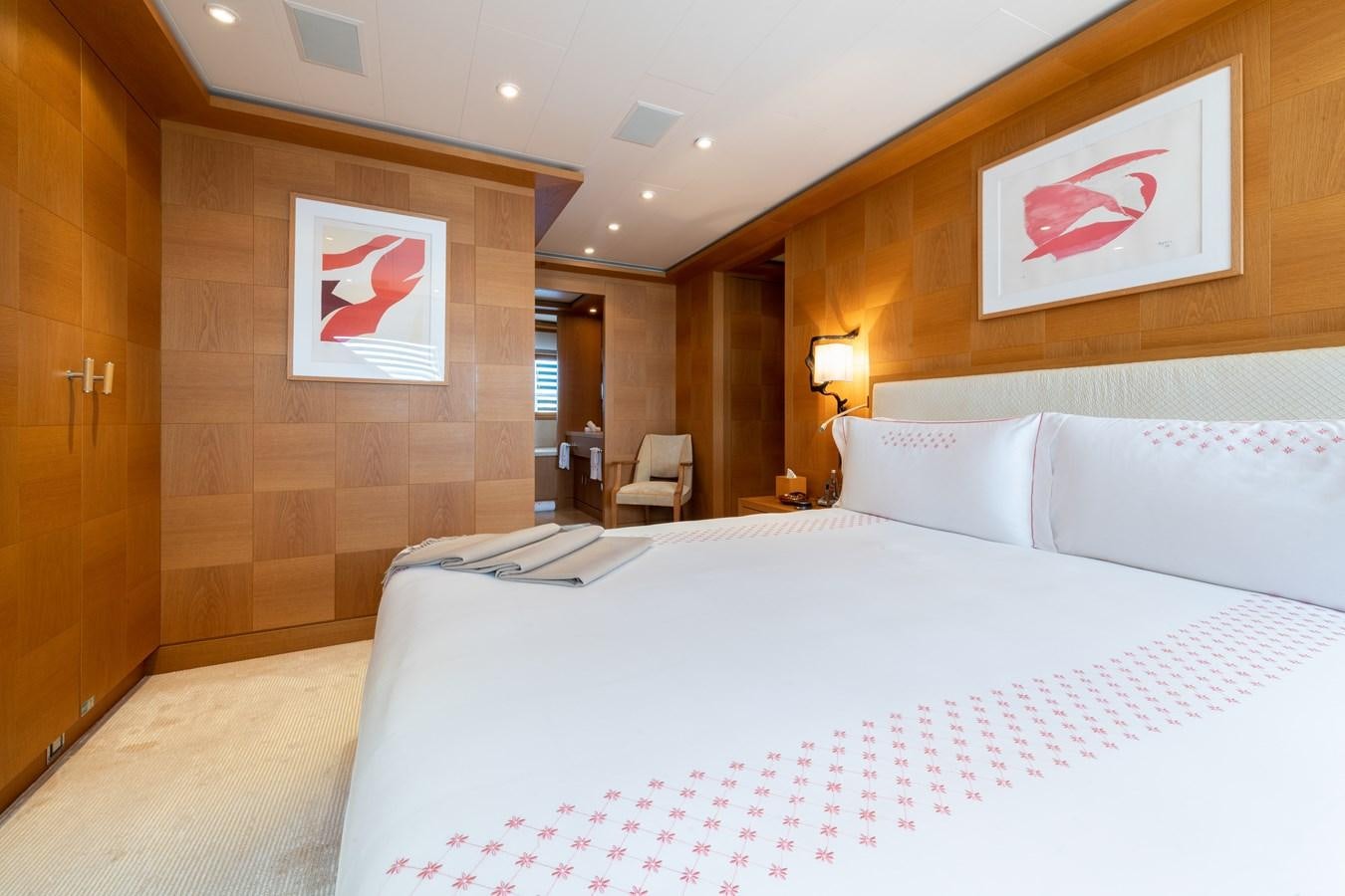 a large bed in a hotel room aboard AALTO Yacht for Sale