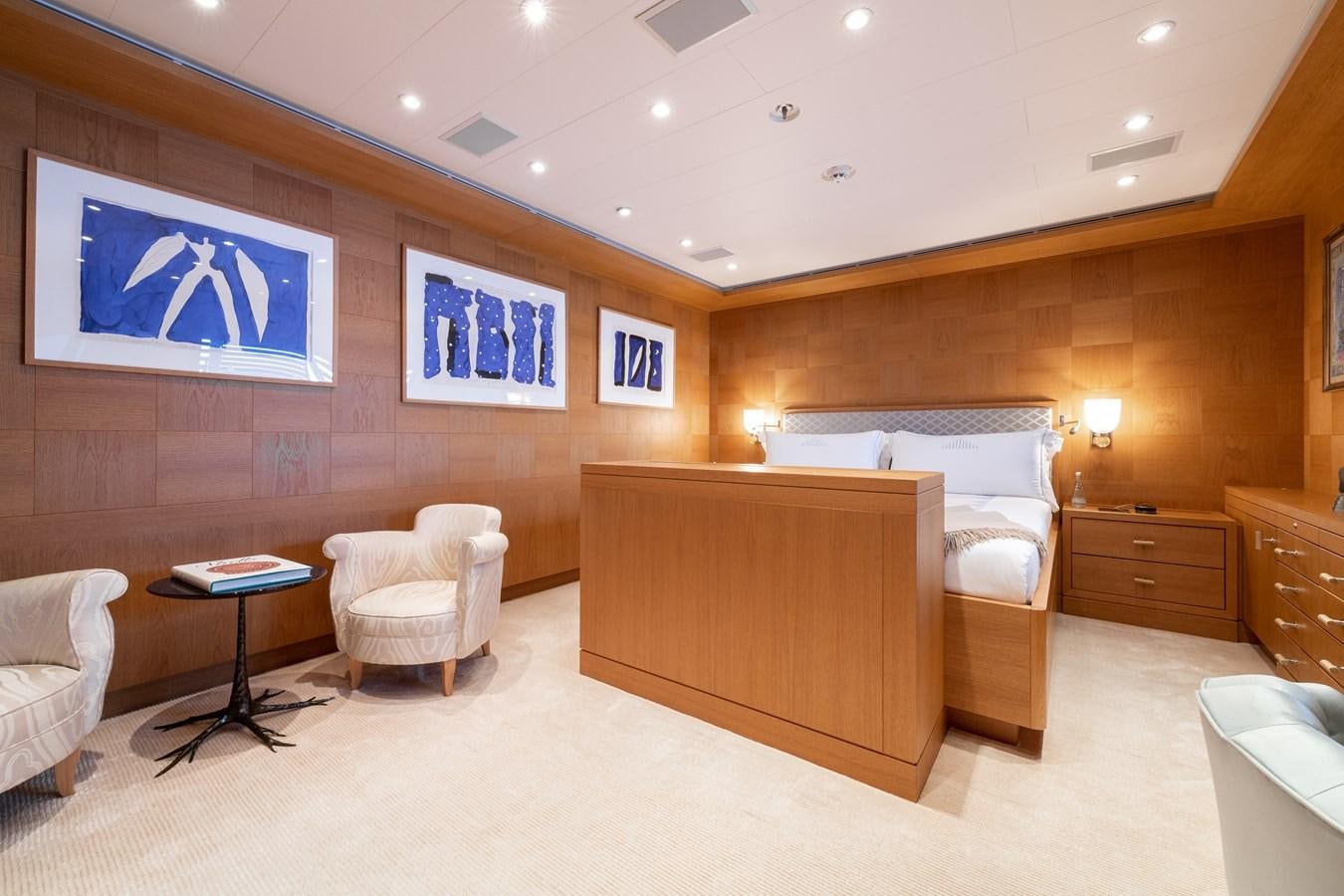 a room with a bed and a desk aboard AALTO Yacht for Sale