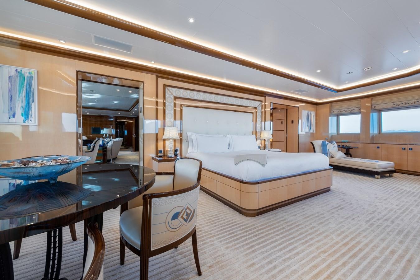 a bedroom with a bed and a desk aboard AALTO Yacht for Sale