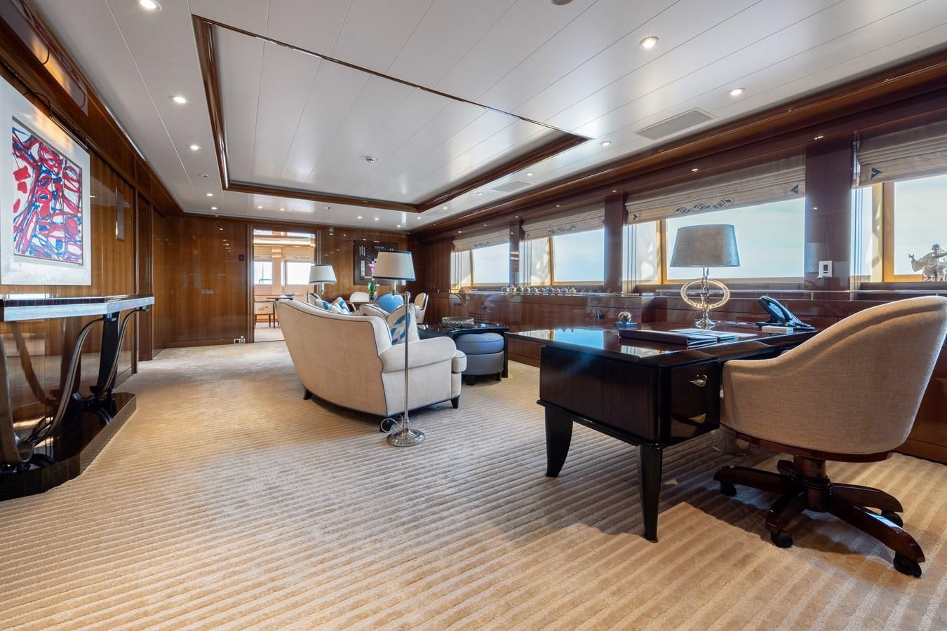 a living room with a large table and chairs aboard AALTO Yacht for Sale