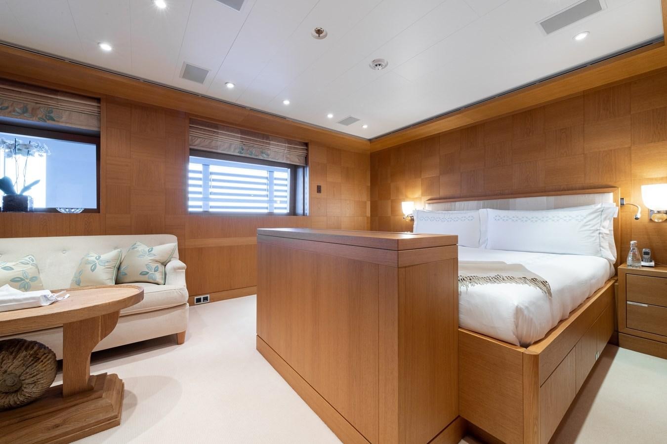 a room with a bed and a couch aboard AALTO Yacht for Sale