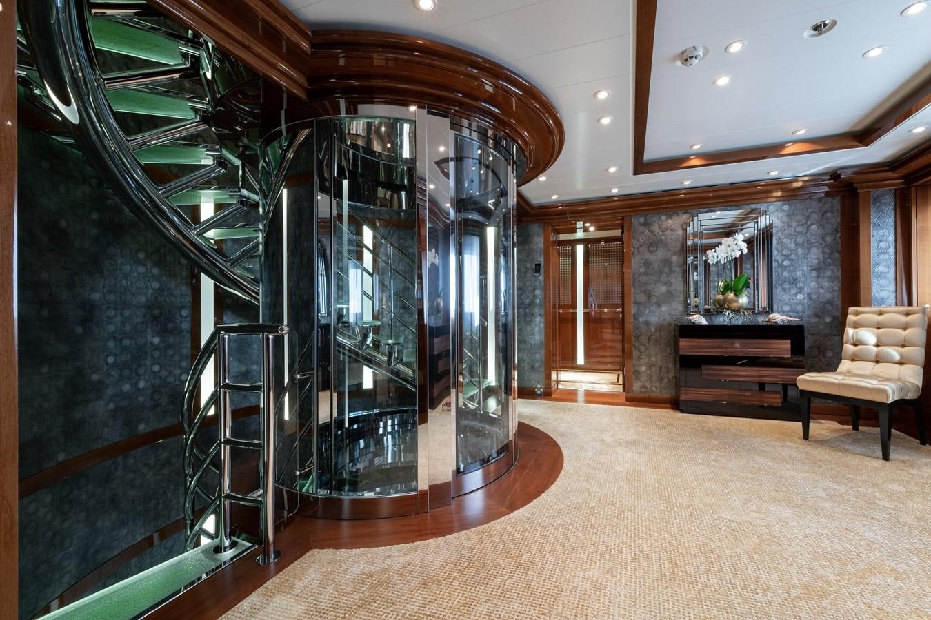 a room with a glass wall and a staircase aboard AALTO Yacht for Sale