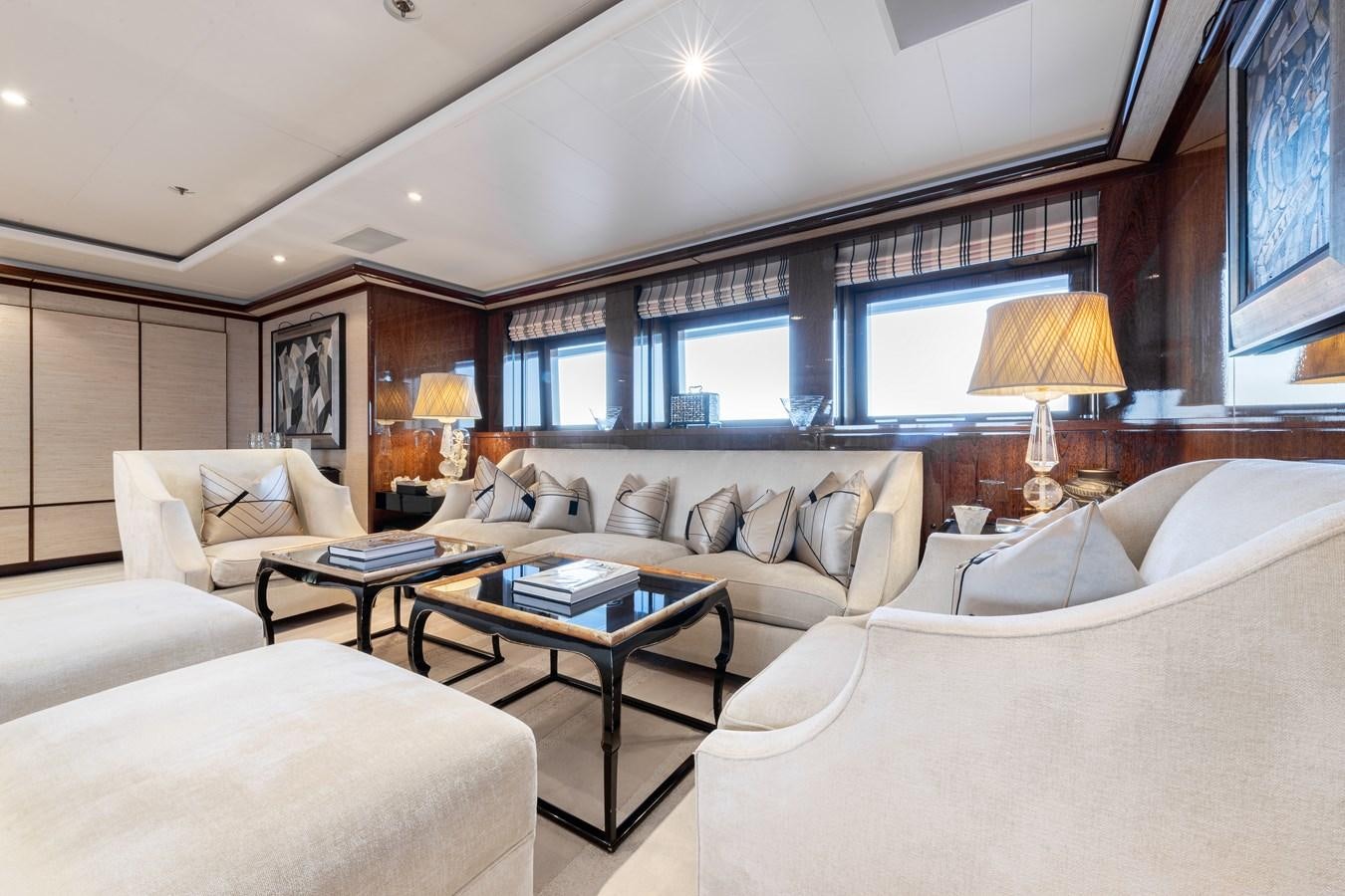 a large room with a bed and a table aboard AALTO Yacht for Sale
