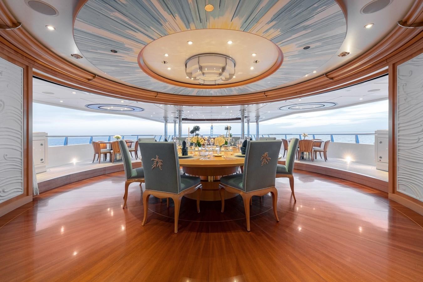 a room with a table and chairs aboard AALTO Yacht for Sale