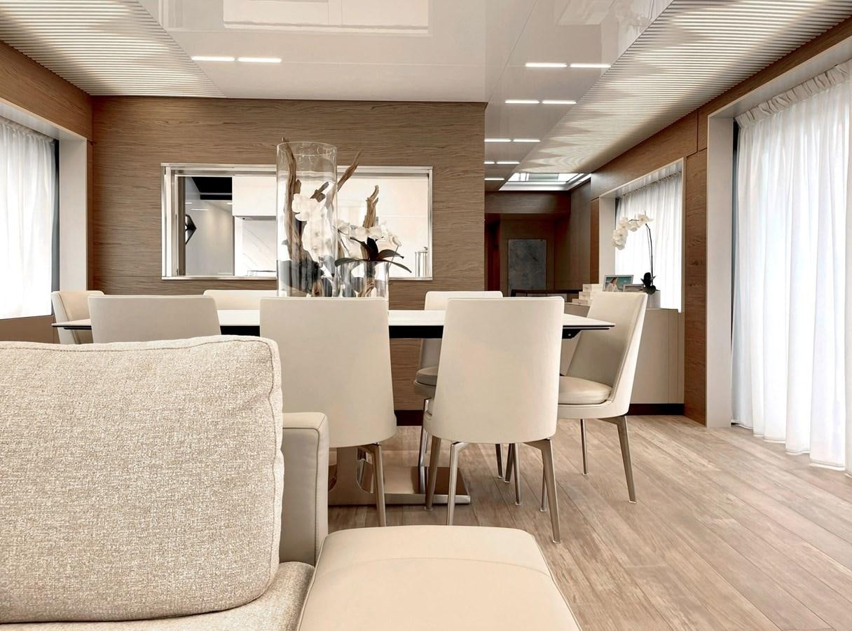 a room with a table chairs and a television aboard FERRETTI YACHTS 920 HT  Yacht for Sale