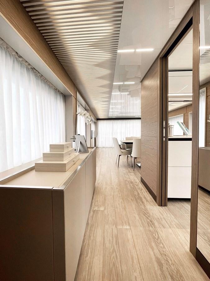 a room with a wood floor and white walls aboard FERRETTI YACHTS 920 HT  Yacht for Sale