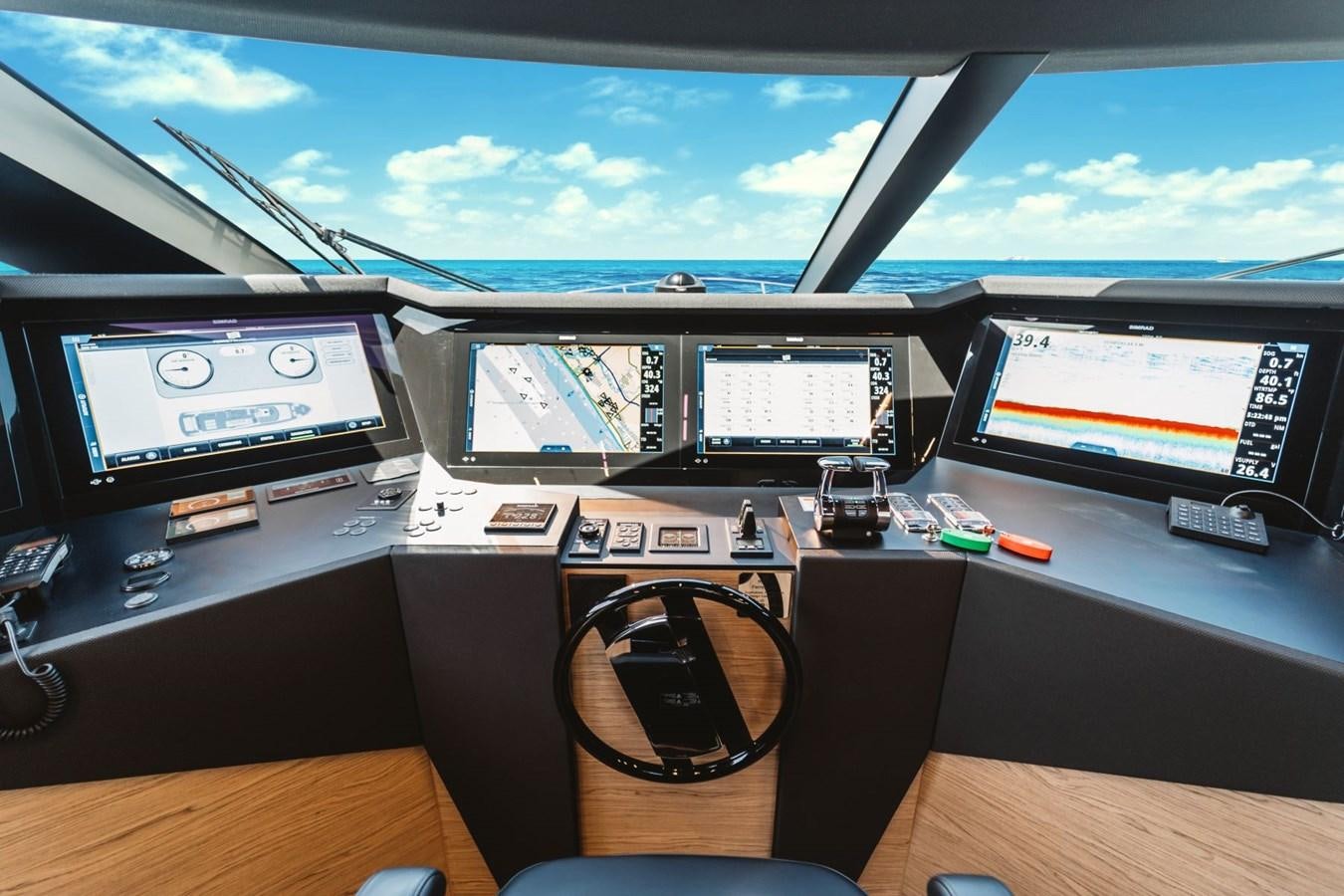a desk with computers and monitors aboard FERRETTI YACHTS 920 HT  Yacht for Sale