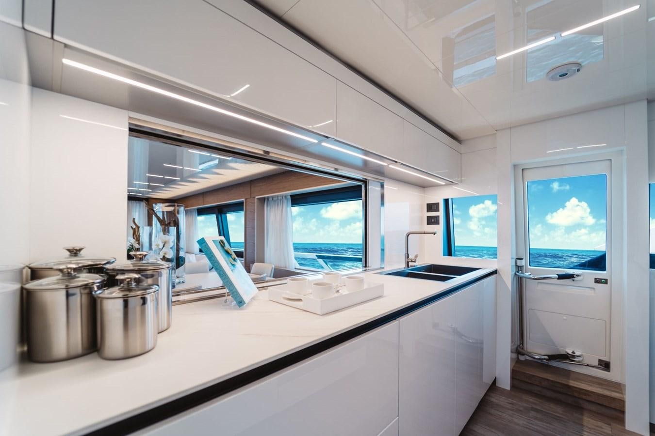 a kitchen with a large window aboard FERRETTI YACHTS 920 HT  Yacht for Sale