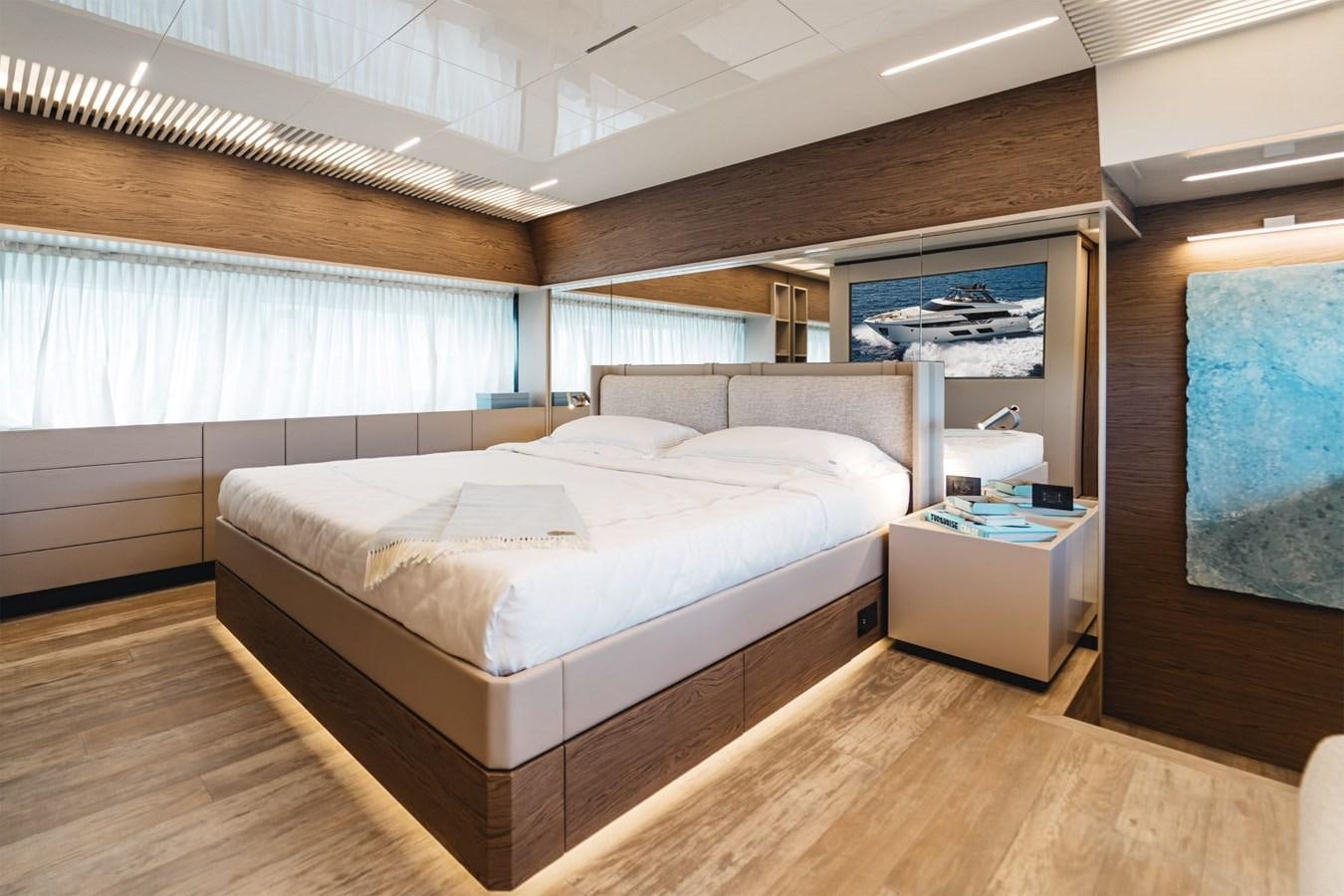 a room with a bed and a window aboard FERRETTI YACHTS 920 HT  Yacht for Sale