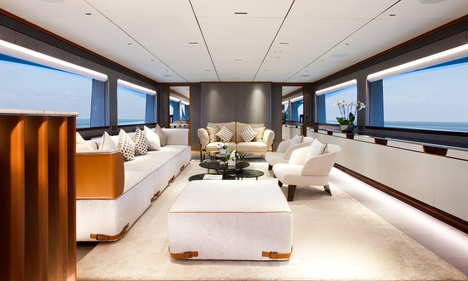 a room with a couch and a tv aboard HORIZON RP120 Yacht for Sale