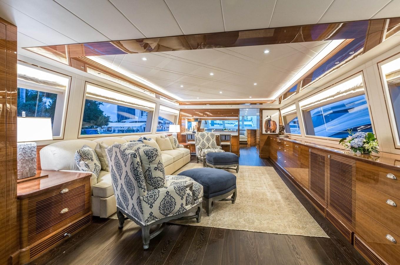 a living room with a couch and a television aboard HORIZON E100 Yacht for Sale