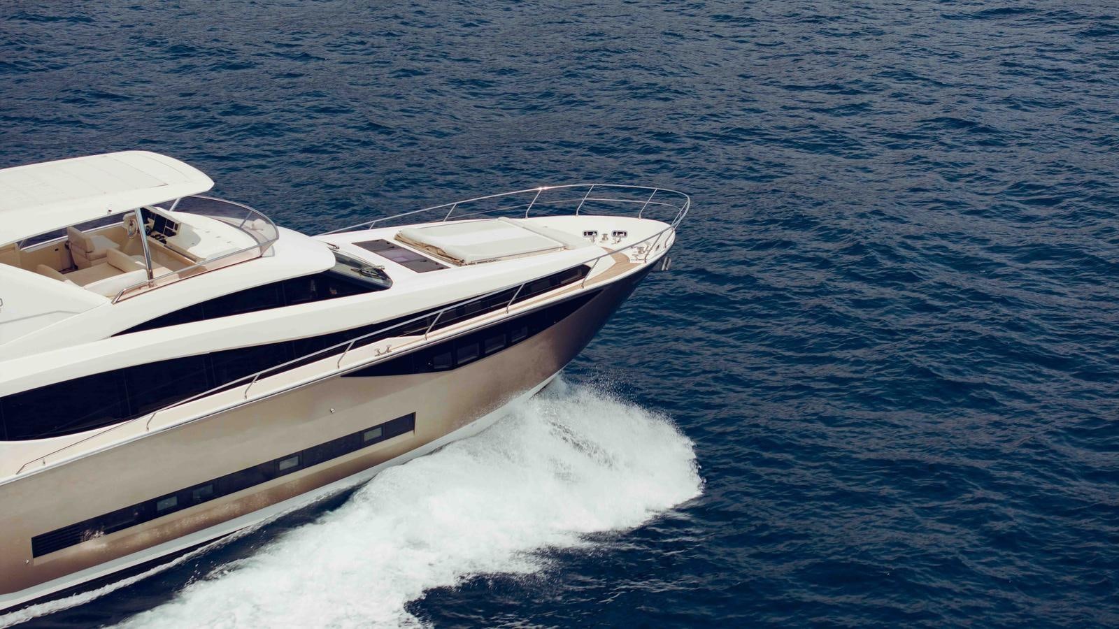 a white boat on the water aboard FEU D'OR Yacht for Sale