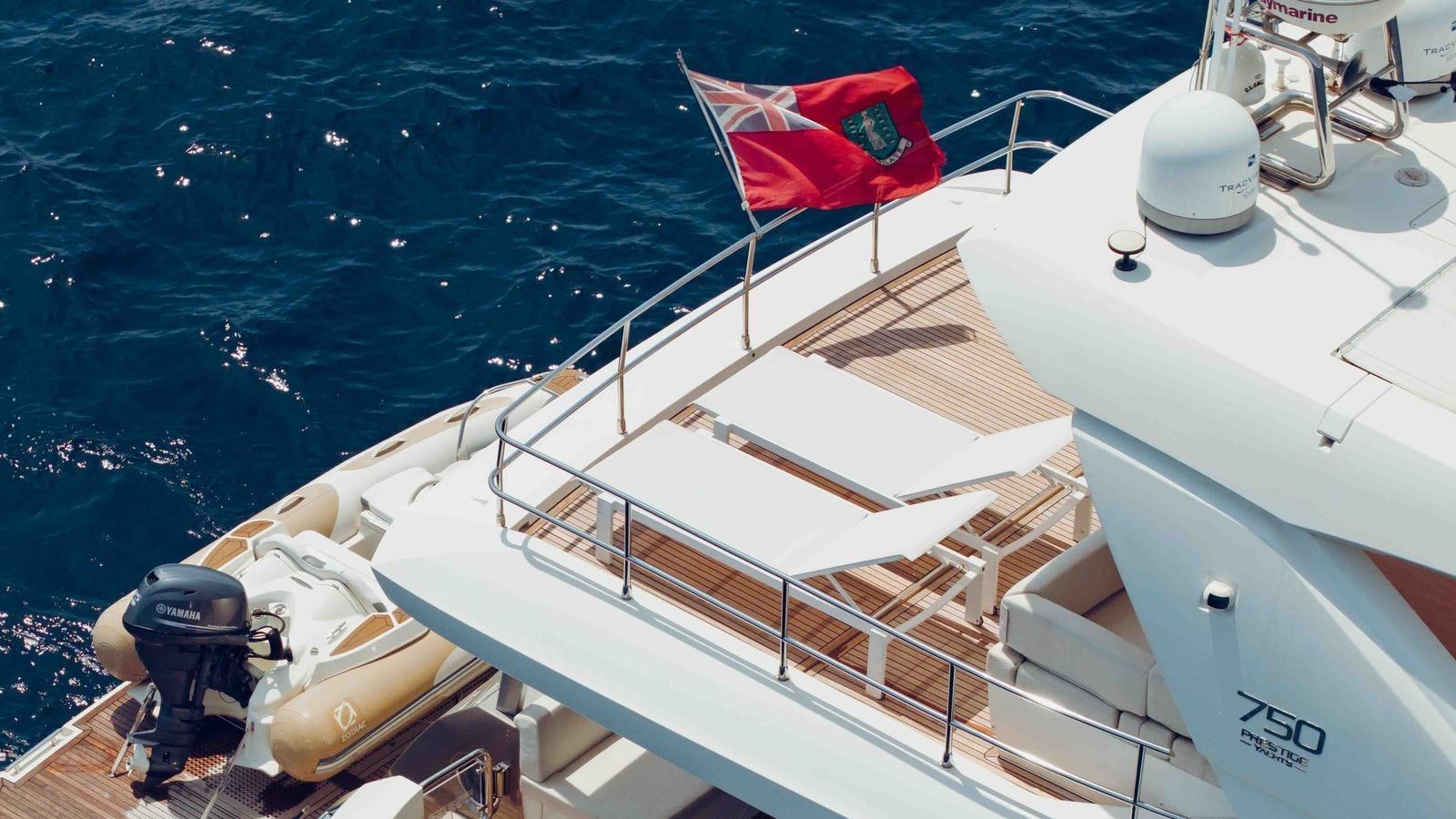 a boat with a flag on the front aboard FEU D'OR Yacht for Sale