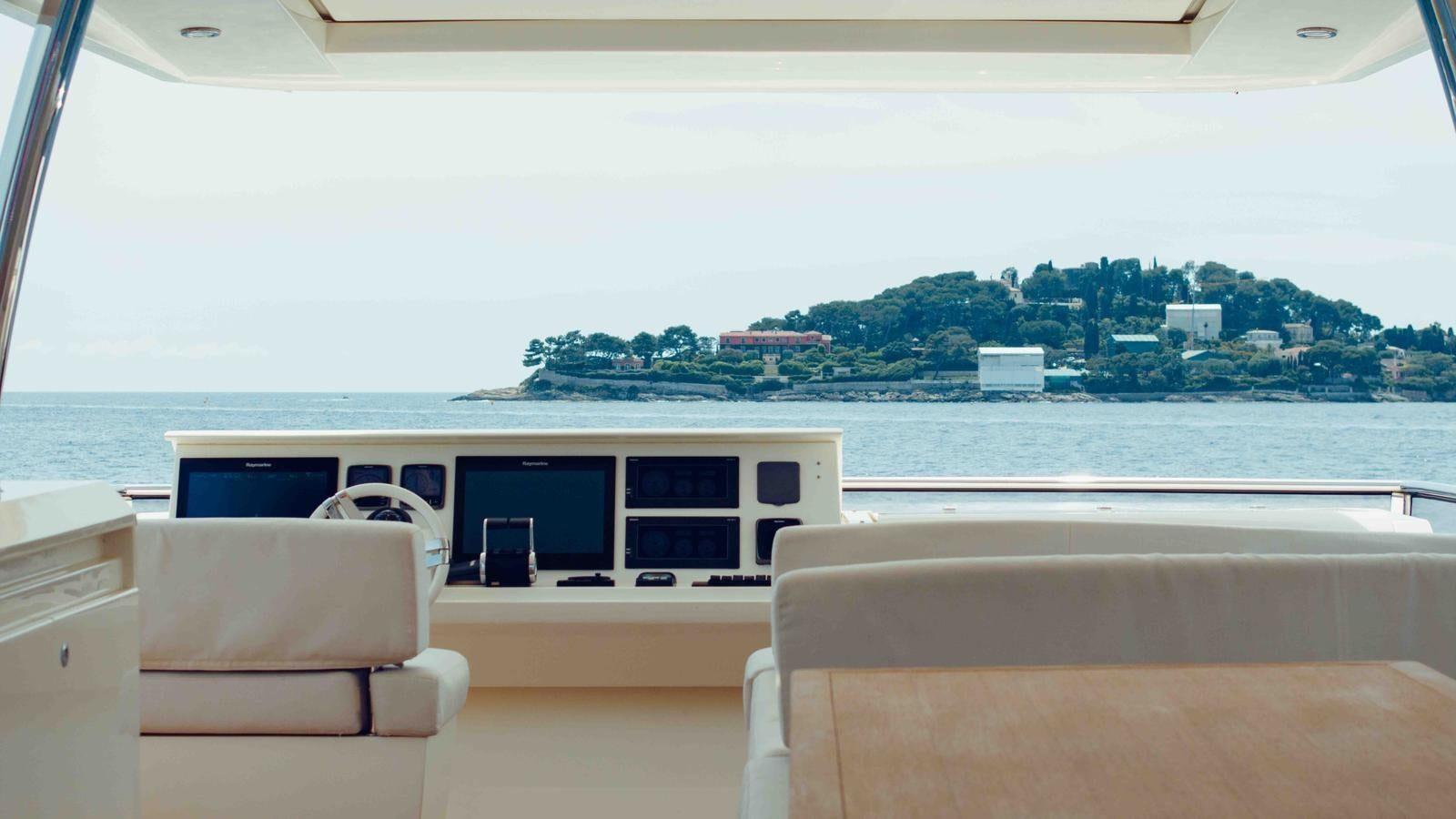 a room with a view of a city and water aboard FEU D'OR Yacht for Sale