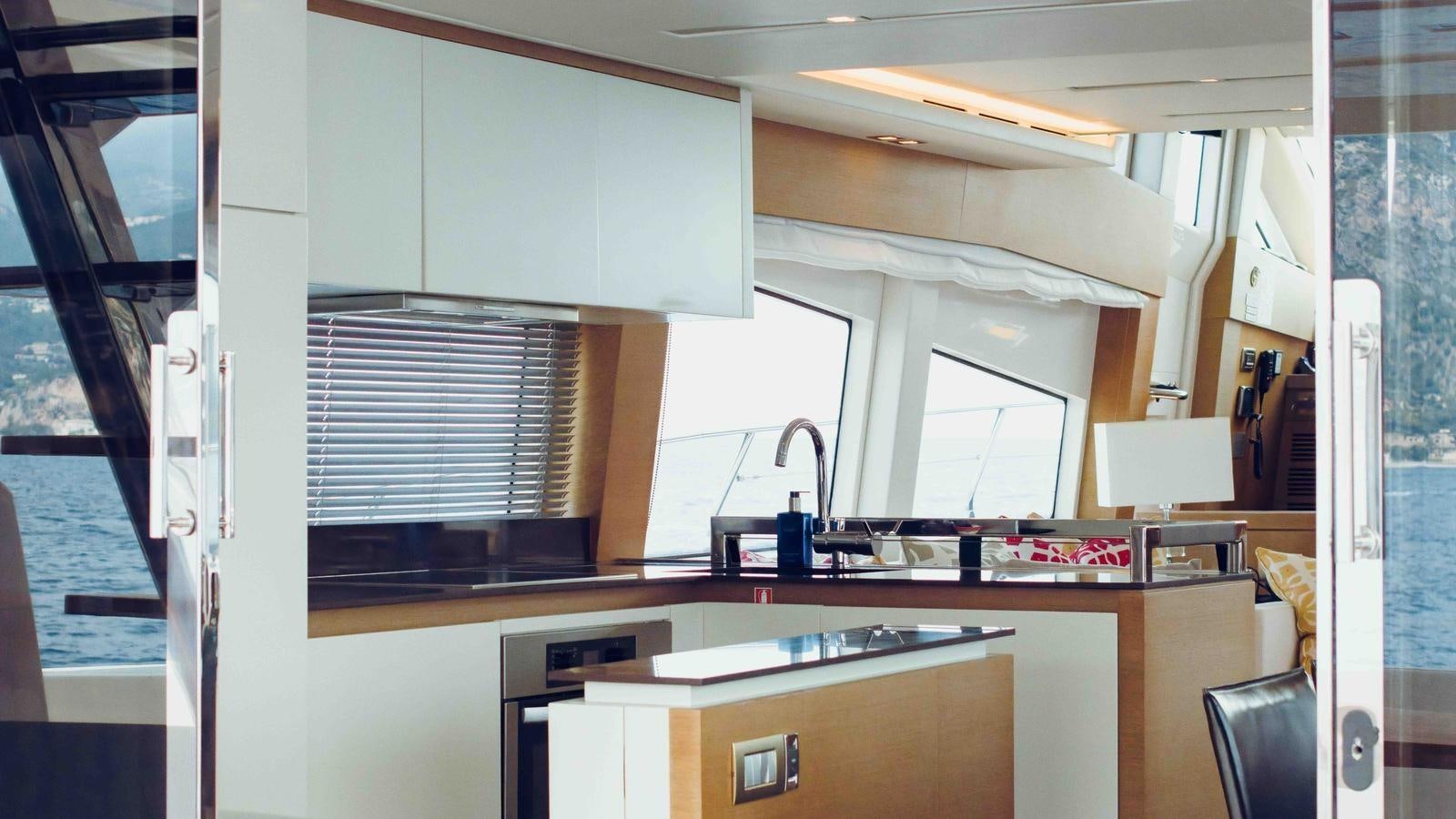 a kitchen with a sink and cabinets aboard FEU D'OR Yacht for Sale