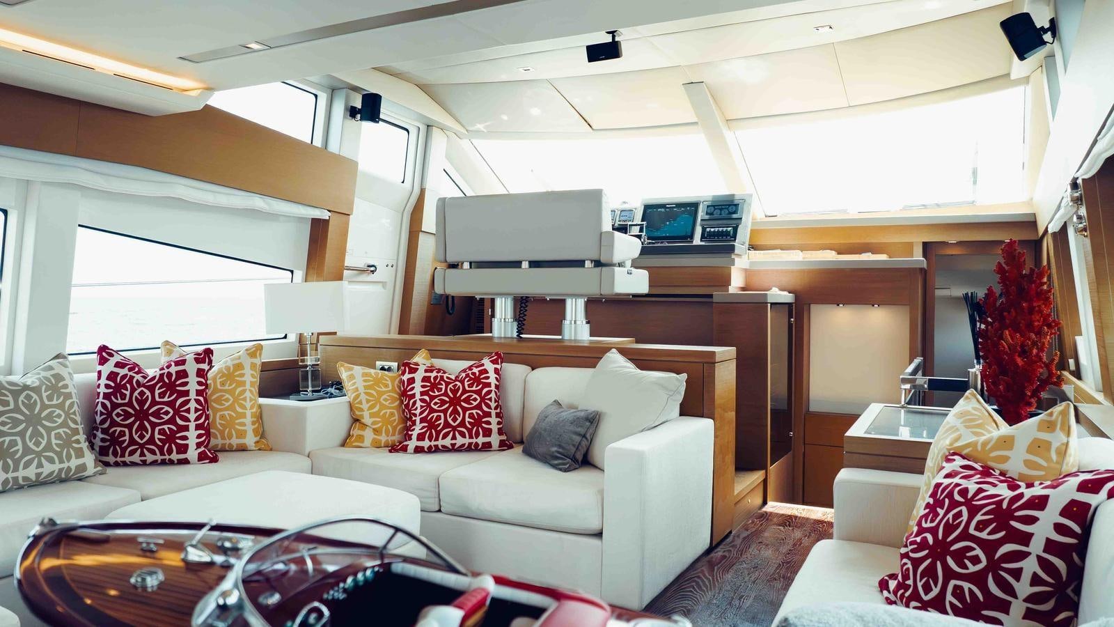 a living room with a couch and a television aboard FEU D'OR Yacht for Sale