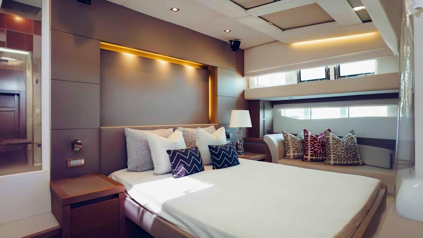 a room with two beds aboard FEU D'OR Yacht for Sale