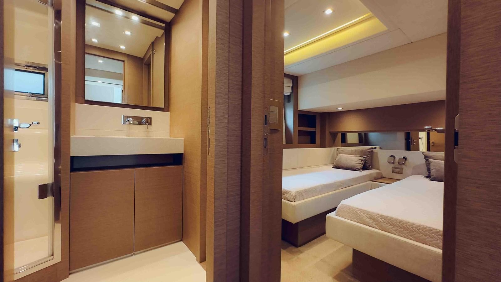 a room with a bed and a mirror aboard FEU D'OR Yacht for Sale