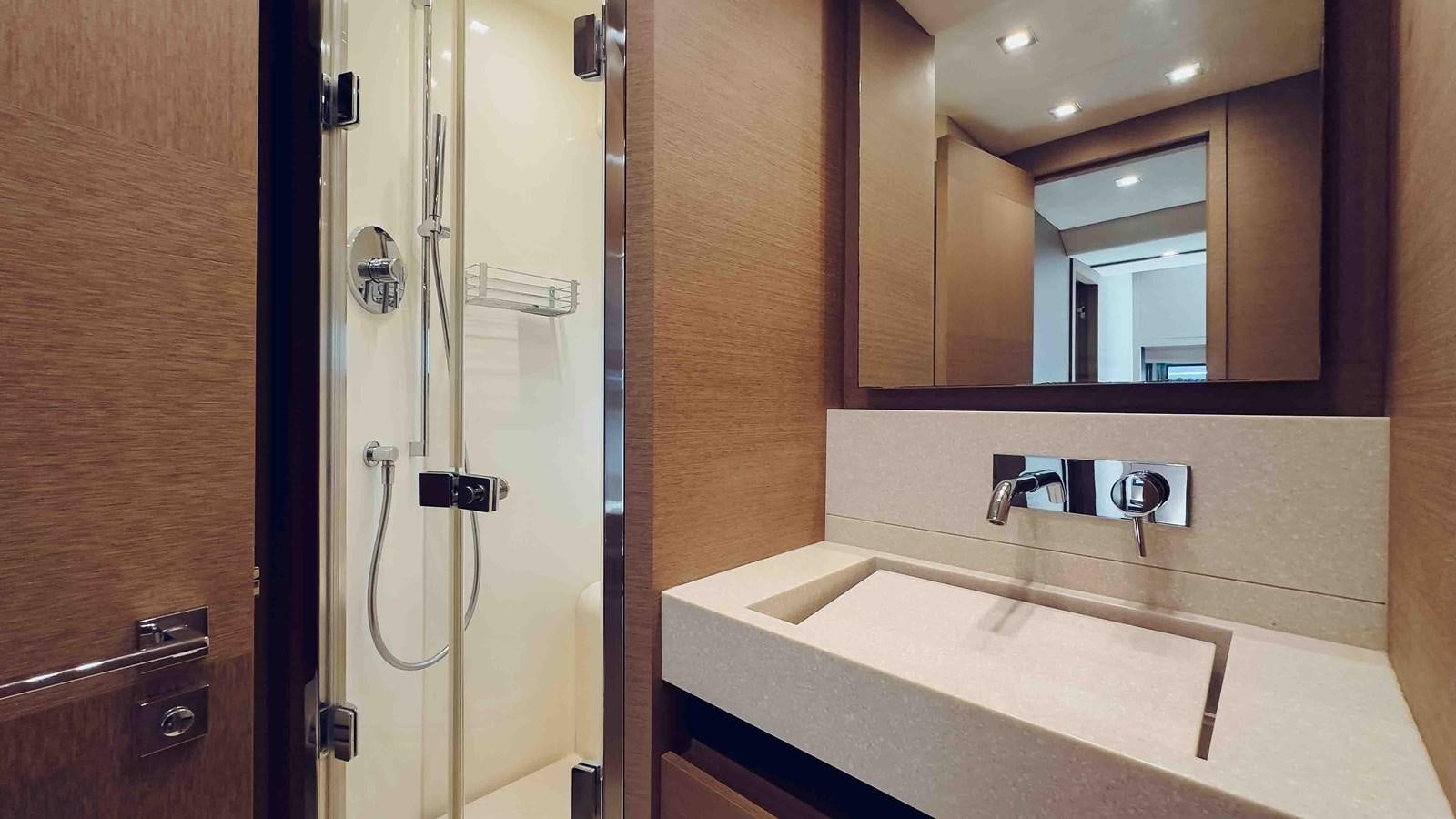 a bathroom with a large mirror aboard FEU D'OR Yacht for Sale