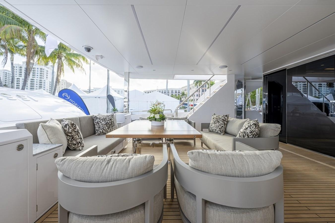 a living room with a couch and a table aboard FD80 Yacht for Sale