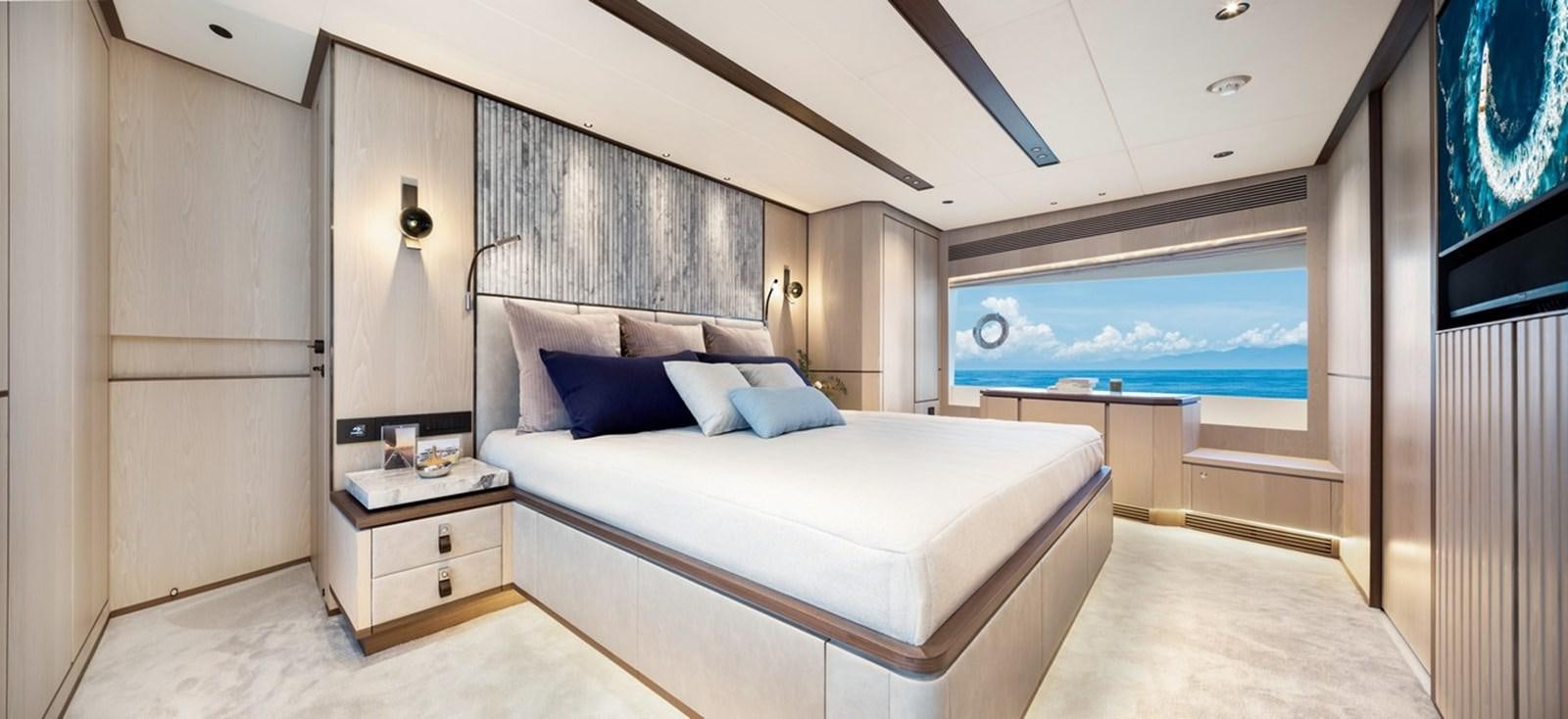 a room with a bed and a window aboard FD80 Yacht for Sale
