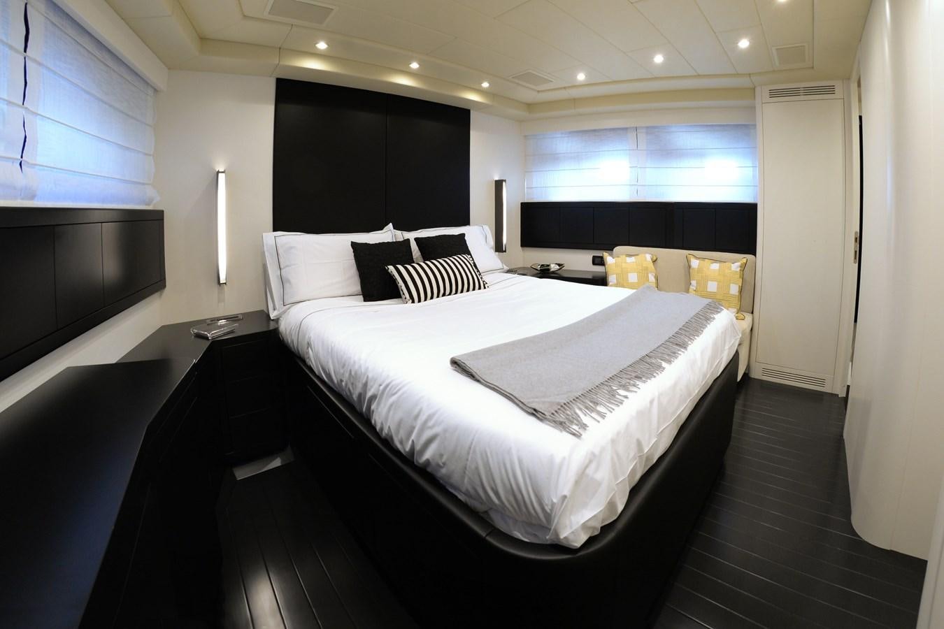 a room with a bed and a window aboard ONLY ONE Yacht for Sale