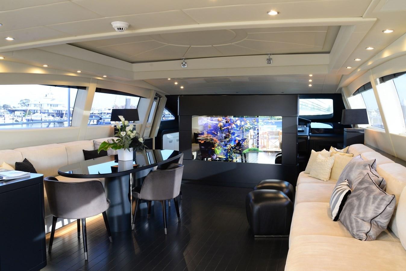 a living room with a large screen aboard ONLY ONE Yacht for Sale