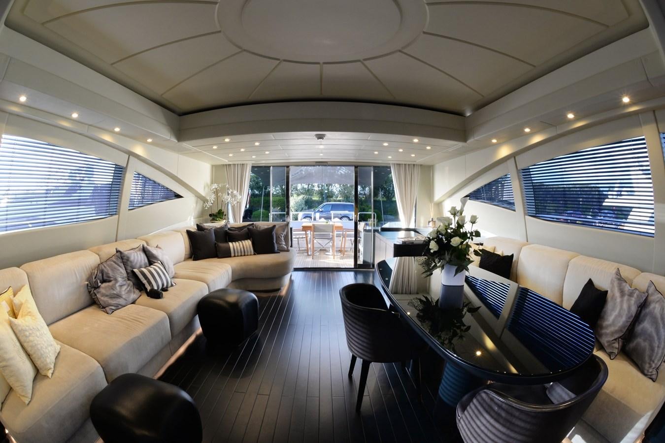a living room with a large window aboard ONLY ONE Yacht for Sale