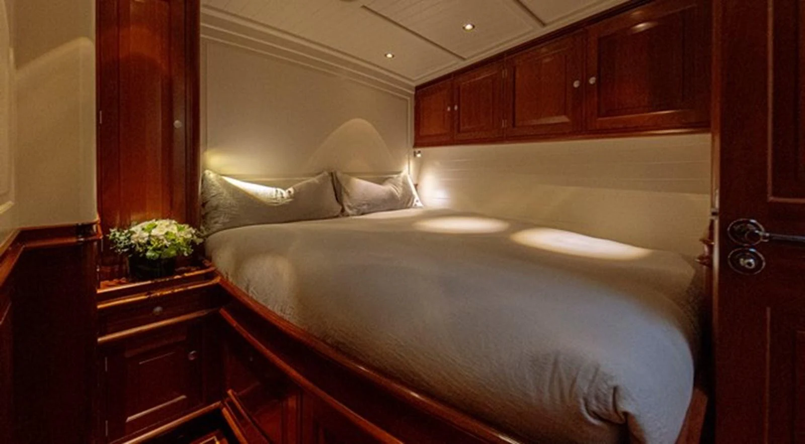 a bed with a white sheet aboard ATALANTE Yacht for Sale
