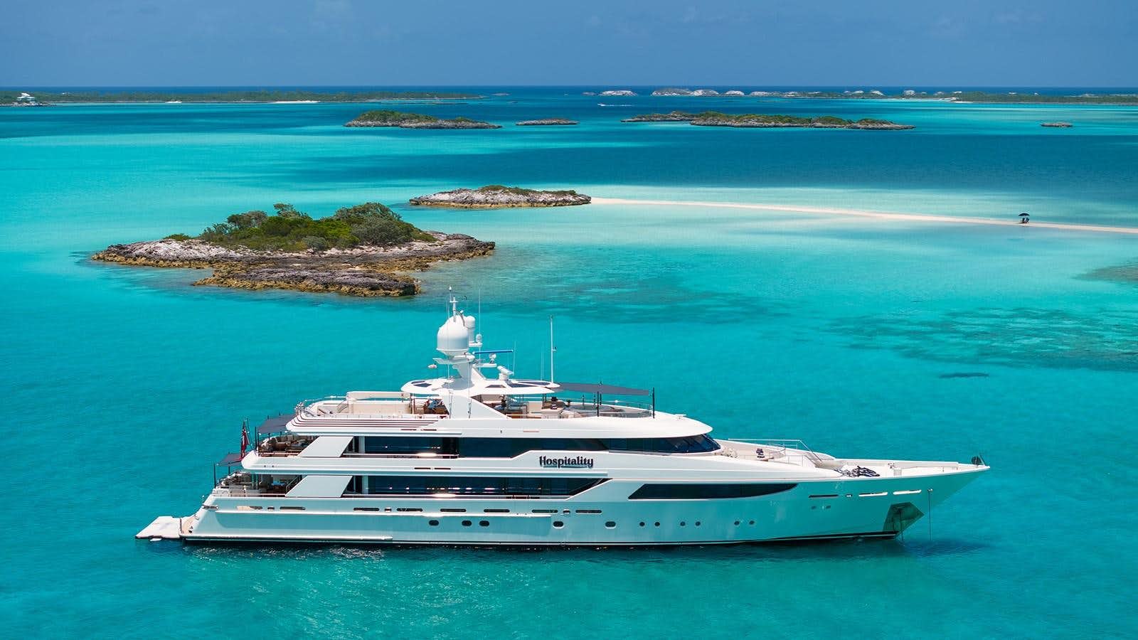 a white yacht in the ocean aboard HOSPITALITY Yacht for Sale